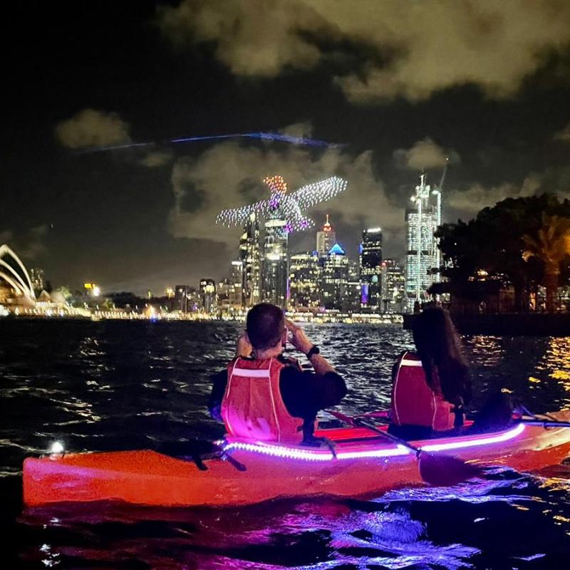 a person riding on the back of a boat in the water