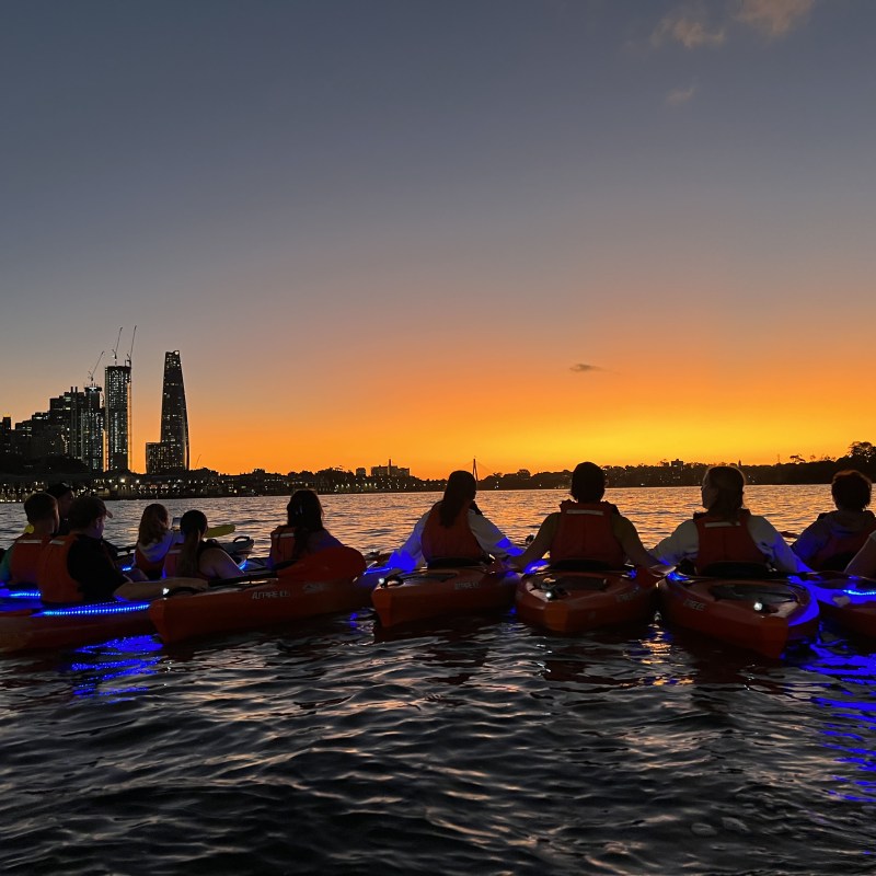 a group of people on a boat in a body of water