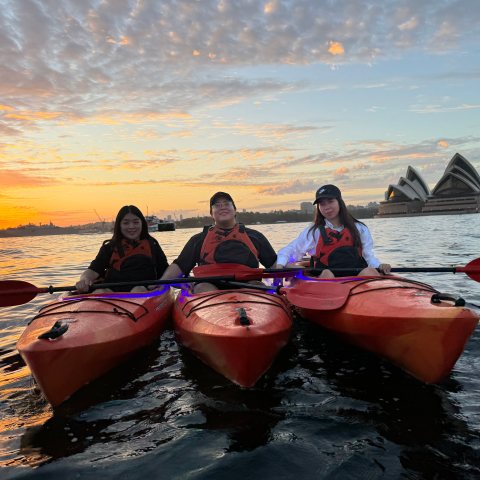 a group of people on a boat in the water