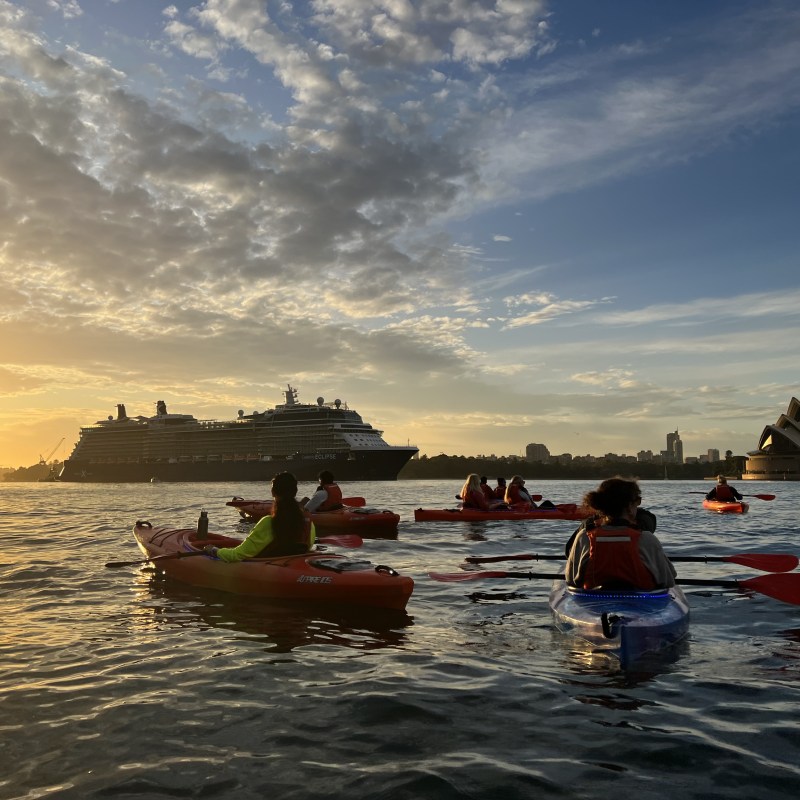 a group of people in a boat on a body of water
