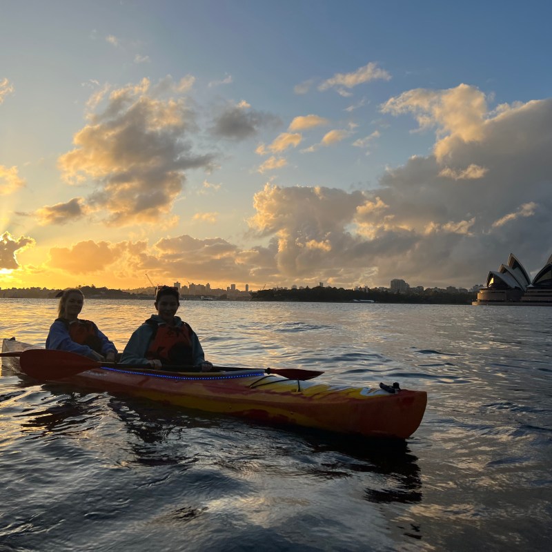 a group of people in a boat on a body of water