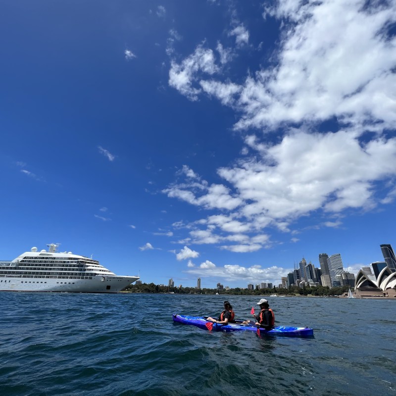 a group of people in a boat on a body of water
