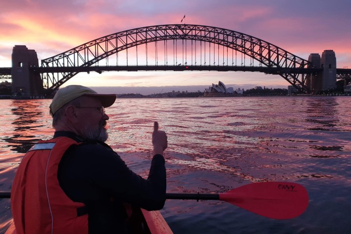 a person with a bridge over a body of water