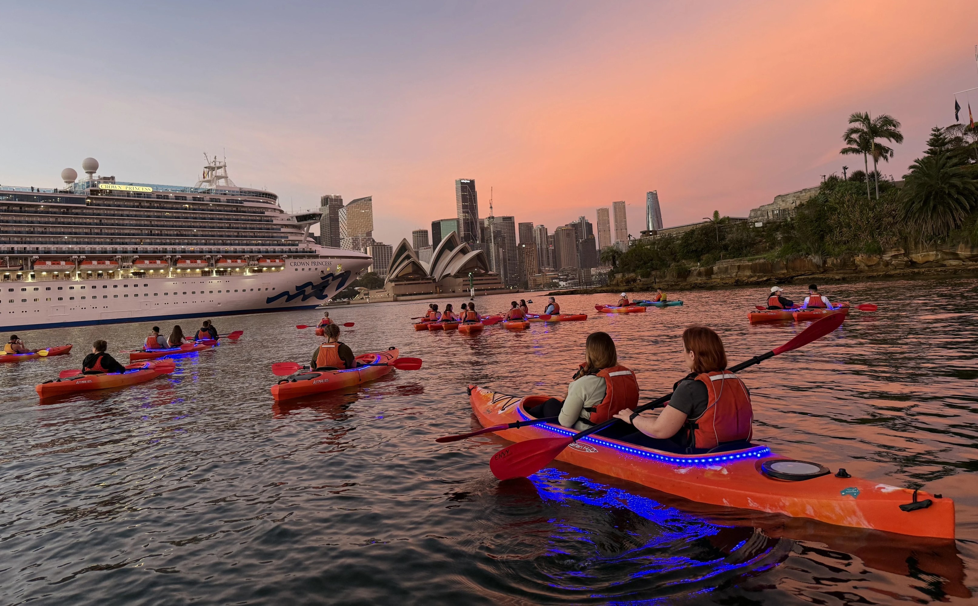 a group of people on a boat in the water