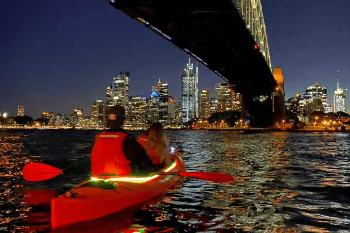 a person riding on the back of a boat in the water